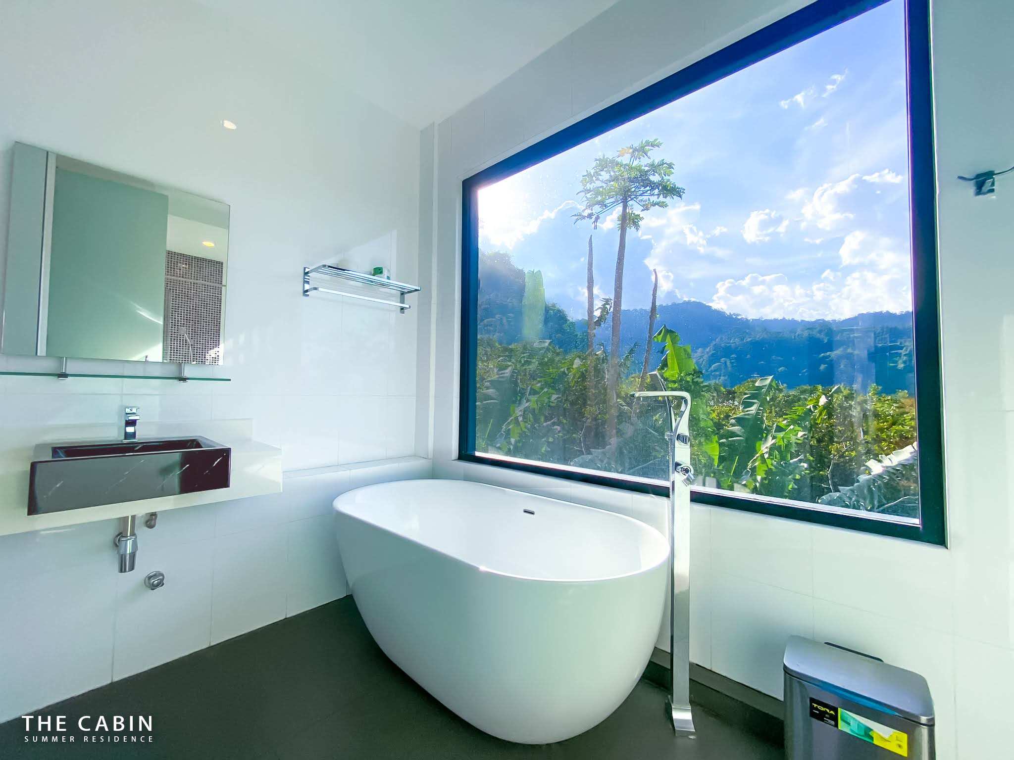 The Room 1 ensuite from wider back, the whole window wall visible.