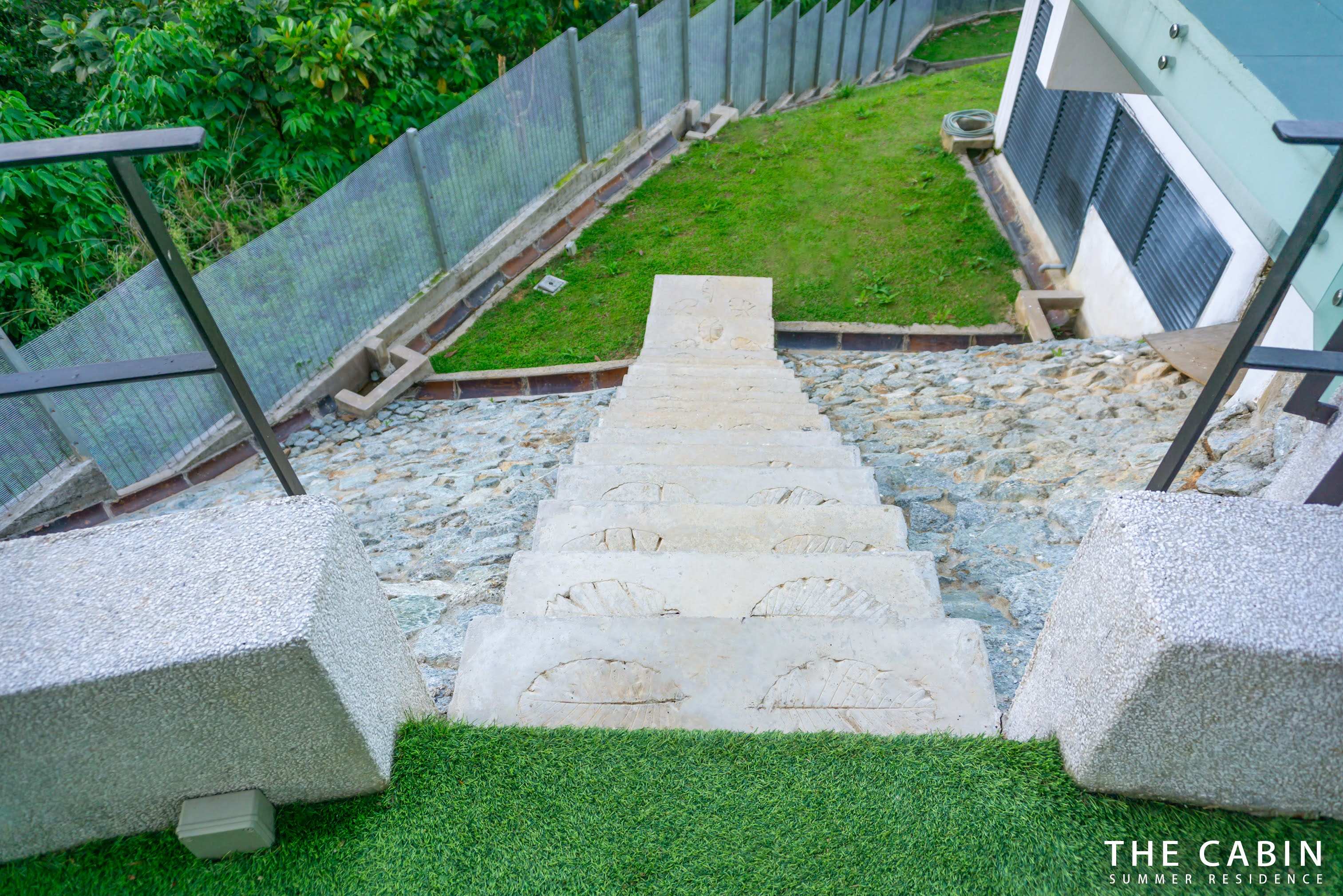 Steps up through the garden to the roof terrace level.